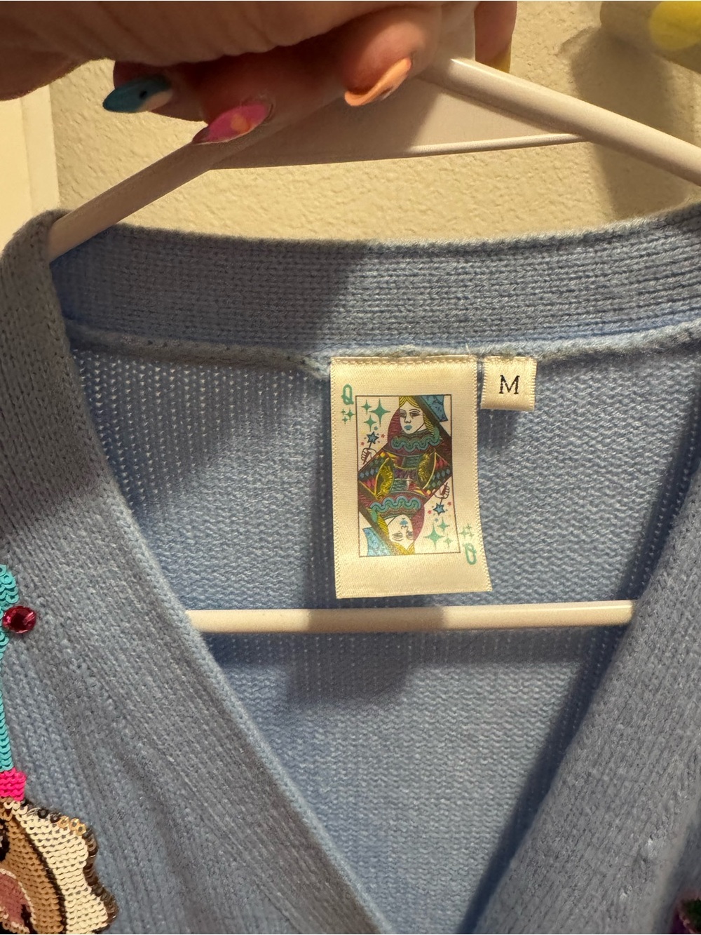 Light Blue Cardigan Sweater with Colorful Nutcracker Sequin Design - Picture 9 of 9